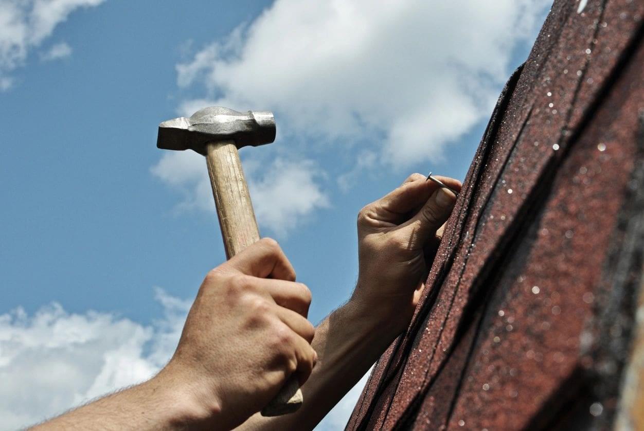 A man pinning a nail